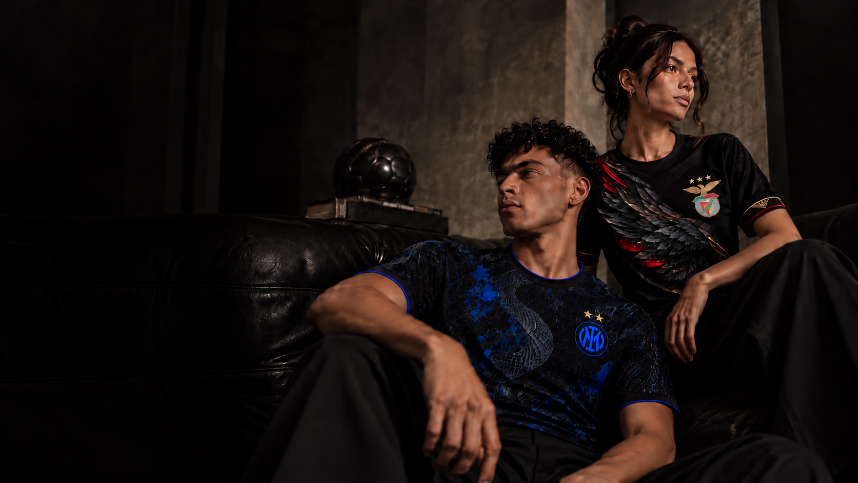 Two people wearing Moments Eleven football shirts.